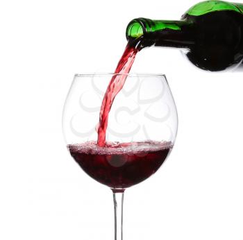 Red wine pouring on white background