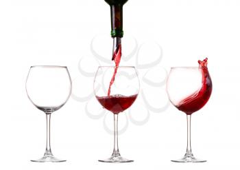 Wine collection - Splashing red wine in a glass. Isolated on white background and pourer