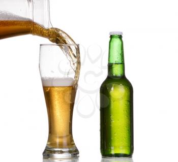Isolated Glass and Brown bottle of beer on a white background