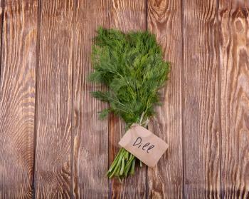 Dill on wooden table