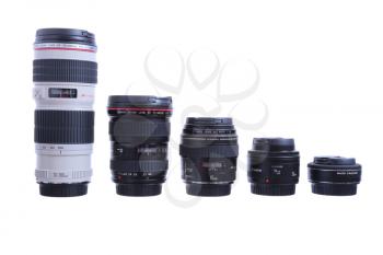 KYIV, UKRAINE - JULY 10, 2015: Set of Canon EF lenses containing a 8-15mm fish-eye, a 16-35mm, a 50mm, a 100mm Macro lens, a 24-70mm zoom lens and a 70-200mm tele.