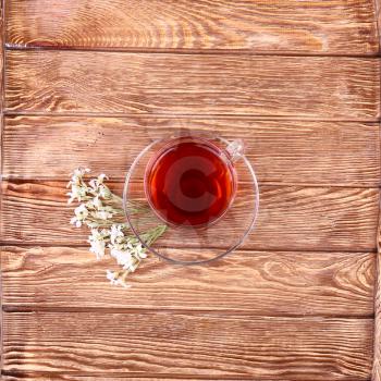 Herbal tea with herb on old wooden table. Top view. alternative medicine concept