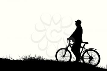 Silhouette of sports person cycling on the field on the beautiful sunset