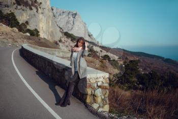 Beautiful Young Girl. Trip to the forest, to the mountains. Beautiful nature above the rocks and the sea. Crimea, Staroyalitinskaya road