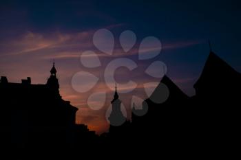Silhouettes an evening old city in Warsaw. The historical center of Poland. Sunset, spring