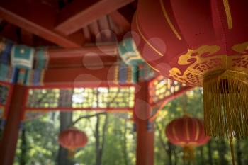 Chinese lanterns in park. Traditional Chinese pavilion or gazebo in the park for recreation