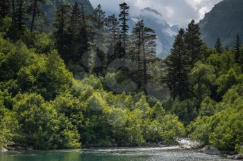 Mountain forest lake landscape. North Caucasus, Dombai, Baduk lakes