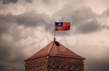 Flag with original proportions. Flag of the Taiwan. beautiful flailing flag on the roof of the old fortress