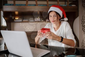 Happy asian woman celebrating friends with video call. Christmas online holiday celebration, Xmas, new year in lockdown coronavirus covid-19 quarantine. New normal, social distance, stay home