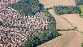 Housing development sprawls near farmland near Luton, England