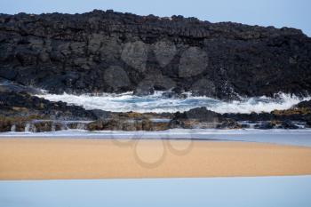 Waves flow over rocks on Lumahai beach on Kauai Hawaii