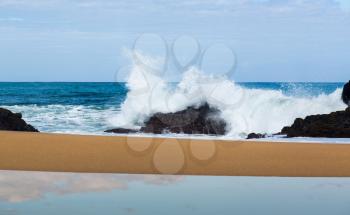 Waves crash onto Lumahai beach in background on Kauai Hawaii