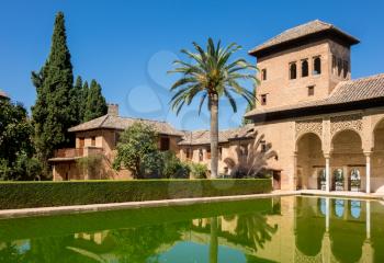 Courtyard and reflecting pool of Partal in Alta Alhambra in ancient city of Granada in Andalucia, Spain, Europe