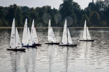 Model yachts or boats race across Round Pond in Kensington Gardens, London, England