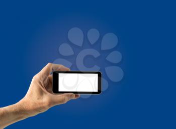 Image of male hand holding smartphone with screen isolated ready for insertion of your application or screenshot against blue gradient background