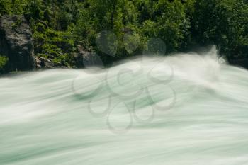Blurred motion of Class six rapids in river by White Water Walk near whirlpool rapids at Niagara Falls