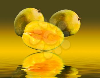 Two whole mangoes and one cut mango reflecting on wavy water surface with green and yellow gradient in the background