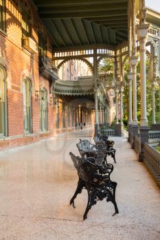 Cast iron chairs on the marble patio or balcony of Henry B Plant museum is moorish inspired architecture part of the University of Tampa.
