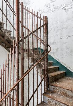 Stairs and cast iron rails inside Trans-Allegheny Lunatic Asylum in Weston, West Virginia, USA