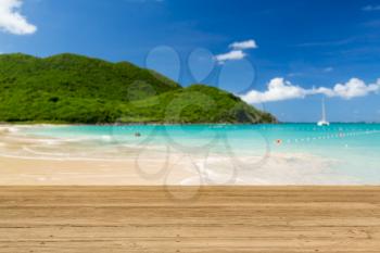 Wooden decking or picnic table on Anse Marcel beach on St Martin in Caribbean in idyllic dreamlike location
