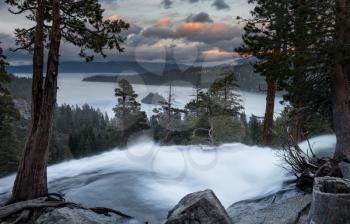 Sunset at Emerald Bay on Lake Tahoe from the top of Lower Eagle Falls as the torrent of water from snow melt flows into the lake from Sierra Nevada Mountains.