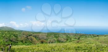 Lonely and remote Auwahi wind turbine generating station past Hana around south of Maui along the coastline