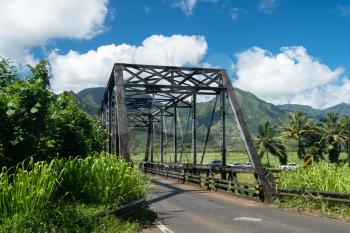 Old metal girder and wood bridge on the road to Hanalei from Princeville in Kauai, Hawaii