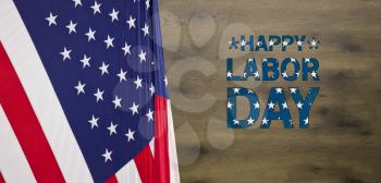 USA flag for Labor Day background poster with wooden table surface as the texture