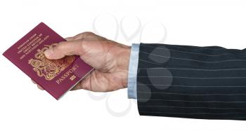 Isolated image of a senior man arm in suit and hand holding a UK or British passport