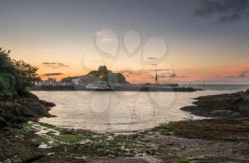 Panorama of the seaside town of Ilfracombe in Devon at sunset with view over harbor and houses