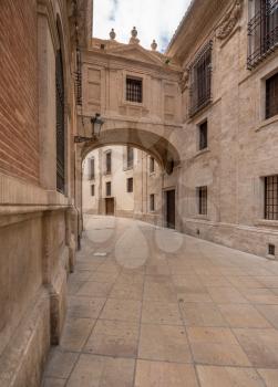 Arch across Barchilla Street between cathedral and Archbishop's Palace in Valencia Spain