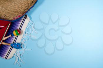 Cinco de Mayo background image on with maracas and sombrero on blue layer