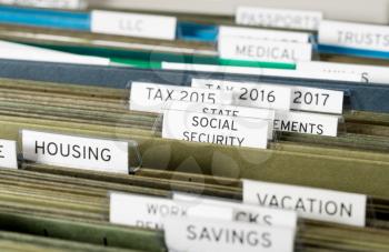 Close up of a well organized home filing system with tabs for each subject with focus on social security