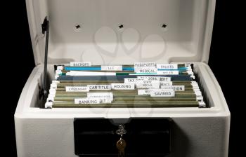 Close up of a well organized home filing system with tabs for each subject in fireproof safe