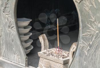 Burning incense at Temple of Supreme Purity or Tai Qing Gong at Laoshan
