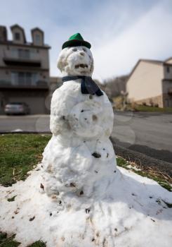 Funny snowman is all that remains of snow storm in spring