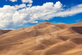 Detailed shot of the shadows on the dunes at Great Sand Dunes National Park in Colorado on a bright sunny but cloudy day