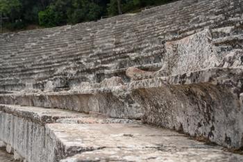 Carved seat in the theater of the Sanctuary of Asklepios at Epidaurus