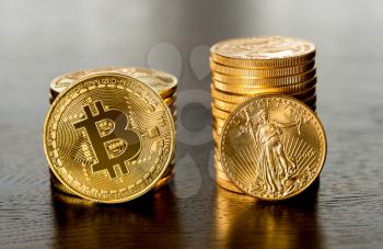 Stack of gold coins alongside stack of bitcoins to illustrate investment choice