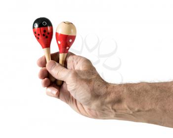 Cinco de Mayo cutout with senior caucasian arm and hand holding two small maracas and isolated against white