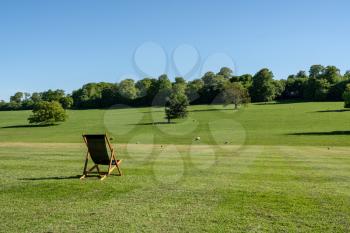 Deckchair in front of typical Derbyshire farming landscape view in England