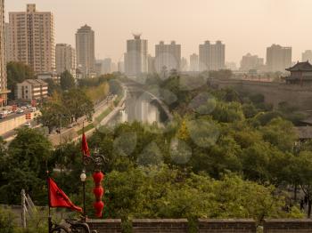 Moat and waterway by the side of the city wall in Xian, China on smoggy day