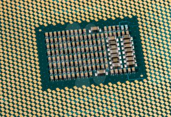Macro photo of the center of the CPU chip ready for insertion into a modern personal computer motherboard
