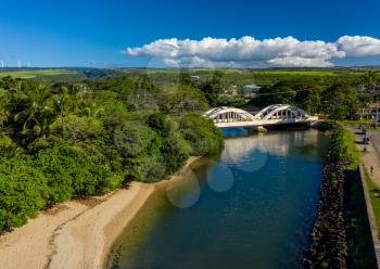 Aerial shot of the river anahulu and the twin arched road bridge in the North Shore town of Haleiwa