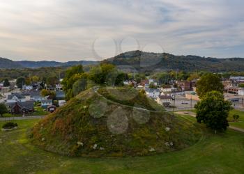 Aerial drone shot of the ancient historic native American burial mound in Moundsville, WV
