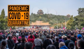 Pandemic sign warning of quarantine due to Covid-19 or corona virus in China with crowds leaving Forbidden City in Beijing