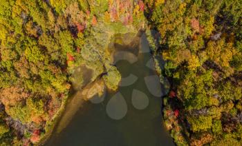 Aerial drone image looking straight down onto the Coopers Rock Lake and Glade Run in the state park in the autumn. Located near Morgantown WV