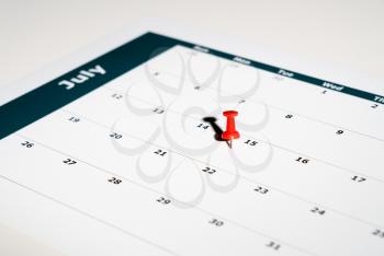 Reminder for sending income tax return for July 15 2020 tax day due to Covid-19 virus delay using calendar page and pin
