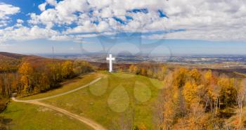Aerial drone view of the metal structure of the Great Cross of Christ on Dunbar's Knob in Jumonville, PA