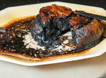 Pastry meat pie completely charred and burned after leaving in the microwave oven too long
